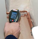Infrared thermometers: infrared thermometer being used to test temperature of frozen goods