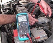 Testing electrical ground of a vehicle using PCE-DM 22 series multimeters.