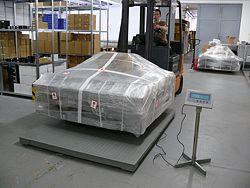 The PCE-EP E floor scale powered by a mains component in a warehouse.