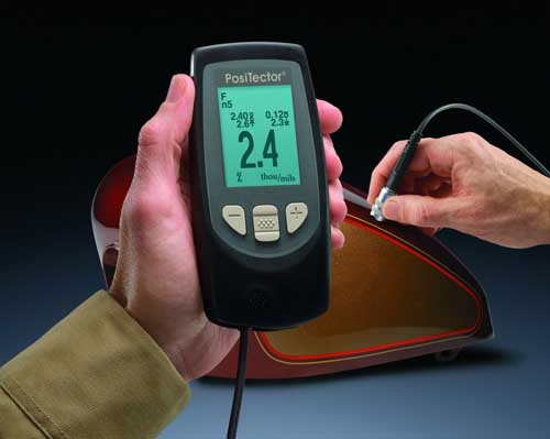 Coat Thickness Meter PT-FN taking measurement on a motorcycle tank