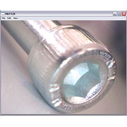 The PCE-MM 200 microscope is being used to analyse a material.