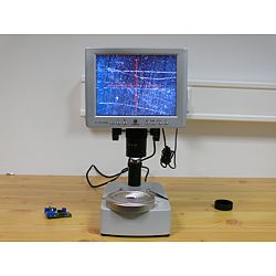 Here the microscope is being used to inspect a metallic surface.