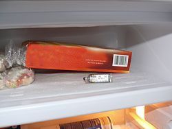 The PCE-MSR145W being used to check temperature in a refrigeration unit.