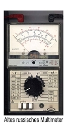The value is shown reflected in a mirror containing the different scales the multimeter uses.