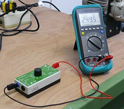 Calibrator for resistance ISO-Kalibrator 1 checking a multimeter.