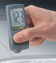 Coating Thickness Meter DFT-Ferrous taking measurement in an automobile