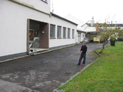 Earth resistance meter measuring earth resistance in a building.