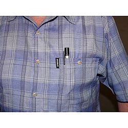The PCE-PTM 100 microscope in a technician's shirt pocket.