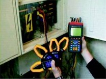 The PCE-360 power analyzer and the portable energy meter measuring an electric cupboard.