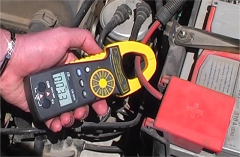 The CM-9940 Voltmeter measuring the car battery